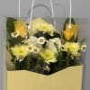 Sunshine-soft yellow rose buds and pale yellow chrysanthemums meet petite white daisies