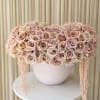 Elegant and softly dramatic, Nude Blooms is a lush composition of premium