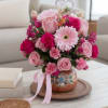 A charming and romantic arrangement featuring a beautiful mix of pink and