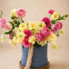 Elegant garden-style flower box with premium seasonal blooms in soft pastel tones