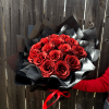 A bouquet of dazzling red roses, each petal shimmering with glitter, wrapped
