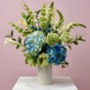 A modern and refined arrangement in serene shades of white and blue