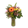 Mixed bouquet of orange, yellow, and pink flowers in a glass vase