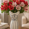 This charming floral arrangement pairs vibrant alstroemeria blooms with a uniquely styled