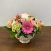 This complimentary blend of colors in this centerpiece will bring cheer to