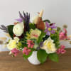 A joyful blend of creamy white roses, lavender clematis, and blush pink