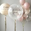 Pastel balloons with clear confetti balloons and gold ribbons
