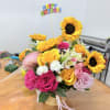 Bright yellow sunflowers and a mix of hot pink, blush, white, and