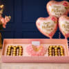 CAJA GARNDE CON CHOCOLATES Y CLAVELES Y GLOBO