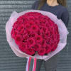 Large bouquet of hot pink roses wrapped in pale pink paper