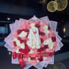 A blush pink, red &amp; white bouquet featuring the initial of your