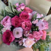 Indulge in a lush tapestry of pinks and deep berries. This hand-tied