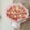 A refined and luxurious bouquet featuring a delicate blend of blush pink