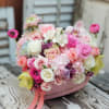 Pink and white rose bouquet in a pink heart-shaped box