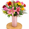 lilies, roses, sunflowers, gerberas and fillers in a luxury pink vase 