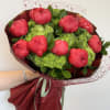 Bouquet of red peonies with green hydrangeas and burgundy wrapping
