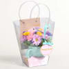 All-around arrangement of fresh blooms, selected and arranged in a reusable mug