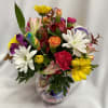 A cheerful mixed-color flower arrangement, making it a joyful choice for a