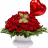 Romantic Elegance is a luxurious statement arrangement featuring 100 premium red roses