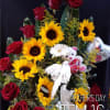Bouquet of red roses and yellow sunflowers with a teddy bear and heart balloon