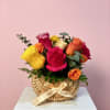 Roses in bright pink, red, yellow, orange and soft cream make this