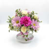 Sweet, delicate, and full of storybook charm, this petite arrangement brings a