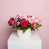The Sweetheart Pearl Arrangement is styled in a smooth white ceramic vase