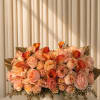 A luxurious blend of soft peach garden roses, delicate spray roses, and