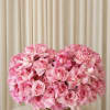Kisses and Blooms is a luxurious arrangement composed entirely of vibrant pink