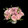 A compact cluster of blush pink roses and pink-to-lavender lisianthus creates a
