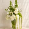 An elegant arrangement with an assortment of blooms. 