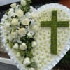 Honor your loved one with a timeless and elegant floral tribute. This