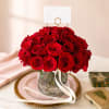 A timeless arrangement featuring two dozen premium red roses designed in an