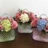 Celebrate Mom with elegance and timeless beauty. Our exclusive floral purse arrangements