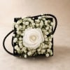 An elegant preserved Ecuadorian rose beautifully displayed in a modern black keepsake