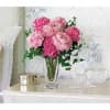 Pink carnations arranged in a clear glass vase
