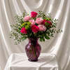 A fresh and naturally styled floral arrangement designed in a modern translucent