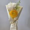 A bright yellow ranunculus paired with a creamy white rose makes this