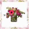 A Mother's Love consists of roses, tulips or cala lilies, hydrangea, gerber