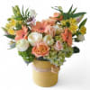 Beautiful yellow and white bouquet filled with roses orchids hydrangeas and more