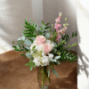 Soft pale pink roses nestled against clusters of white hydrangeas give this