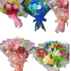 Five colorful bouquets with roses and baby’s breath, wrapped in pastel paper