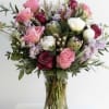 A large bouquet of our favorite roses peonies, accent florals and flowing