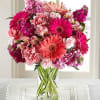 A lush arrangement bursting with vibrant pinks and soft blush tones, this
