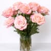 Pink roses arranged in a clear glass vase