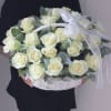 Basket of white roses with eucalyptus and a white ribbon bow