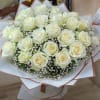 Bouquet of white roses with baby's breath in white and blush wrap