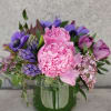 An assortment of violet and pink blooms with a fragrant purple hyacinths