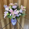 Lavender Whisper opens with a breath of pastel romance-pale pink lilies and