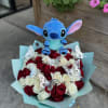 Bouquet of red and white roses with silver butterflies and a blue plush character in aqua wrapping paper